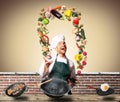 Chef juggling with vegetables