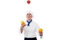 Chef juggling with vegetables Royalty Free Stock Photo