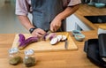 Chef at the kitchen preparing grilled eggplants with garlic Royalty Free Stock Photo