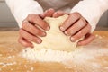 Chef kneading dough