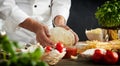 Chef kneading dough for pizza and pasta Royalty Free Stock Photo