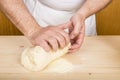 Chef kneading dough to make gnocchi