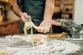 Chef cooking fettuccine in pasta machine Royalty Free Stock Photo