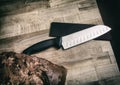 Chef Knife and sleeve on wood butcher block table with bread Royalty Free Stock Photo