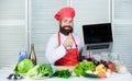Chef laptop read culinary recipes. Culinary school. Hipster in hat and apron learning how to cook online. Culinary Royalty Free Stock Photo