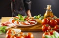 Chef looking at a fresh Caprese salad Royalty Free Stock Photo