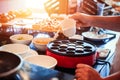 The chef make the dessert on the table and pour milk. Royalty Free Stock Photo