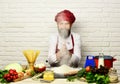 Chef makes dough. Cook with face hidden in flour cloud