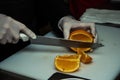 Chef makes orange sliced