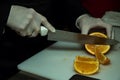 Chef makes orange sliced
