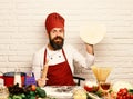 Chef makes pizza. Cooking process concept. Cook with excited face Royalty Free Stock Photo