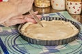 Chef makes stripes on the pie dough with knife before baking in the oven Royalty Free Stock Photo