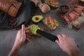 Chef making avocado sandwiches Royalty Free Stock Photo