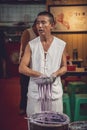 Chef making chinese noodles on market in Chongqing