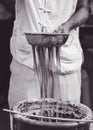 Chef making chinese noodles on market in Chongqing