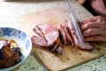 A chef is making fillings for char siu bao, dicing char siu pork Royalty Free Stock Photo