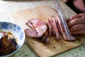 A chef is making fillings for char siu bao, dicing char siu pork Royalty Free Stock Photo