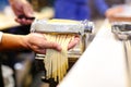 Chef making pasta with a machine, home made fresh pasta Royalty Free Stock Photo