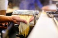 Chef making pasta with a machine, home made fresh pasta Royalty Free Stock Photo