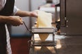 Chef making pasta with a machine, home made fresh pasta Royalty Free Stock Photo