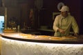 Chef preparing pizza at a cooking contest