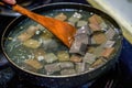 A chef is making pork blood soup