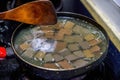 A chef is making pork blood soup