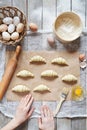 Chef making raw croissants on parchment, preparation process Royalty Free Stock Photo