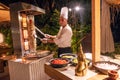 Chef making shawarma during the international cuisine dinner outdoors setup at the tropical island restaurant