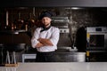 Chef young bearded man at kitchen restaurant