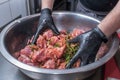 The chef marinates pork meat. Delicious food in the restaurant. Royalty Free Stock Photo