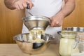 Chef mashing boiled potatoes to make gnocchi Royalty Free Stock Photo
