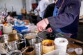 The chef mixes the ingredients in a saucepan using a whisk. Master class in the kitchen. The process of cooking. Step by step.