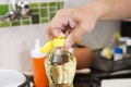 Chef open cap of vegetable oil bottle