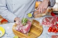 Chef pack vacuum bag with meat and lime on blurred background