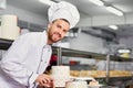 Chef pastry man doing cake in the kitchen