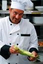 Chef peeling corn