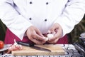 Chef peeling garlic with hand Royalty Free Stock Photo