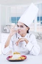 Chef with perfect gesture and delicious food Royalty Free Stock Photo