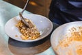 Chef plating cooked Wagyu Ragu with Tagliatelle pasta in white plate Royalty Free Stock Photo