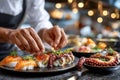 Chef plating sushi and octopus at a restaurant Royalty Free Stock Photo