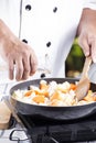 Chef pouring soup to the pan for cooking Japanese pork curry Royalty Free Stock Photo