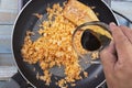 Chef pouring soy sauce to pan for cook fried rice Royalty Free Stock Photo