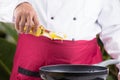 Chef pouring vegetable oil to the pan