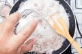 Chef pouring water fro cooking green curry Royalty Free Stock Photo