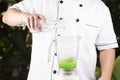 Chef pouring water to the Blender Royalty Free Stock Photo