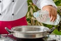 Chef pouring water Royalty Free Stock Photo