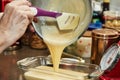 The chef pours the finished dough into mold for making cherry pie, clafoutis. Step by step recipe
