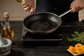 Chef pours olive oil in a pan for making new dish Royalty Free Stock Photo