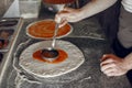 Chef in a white uniform prepare a pizzaa Royalty Free Stock Photo